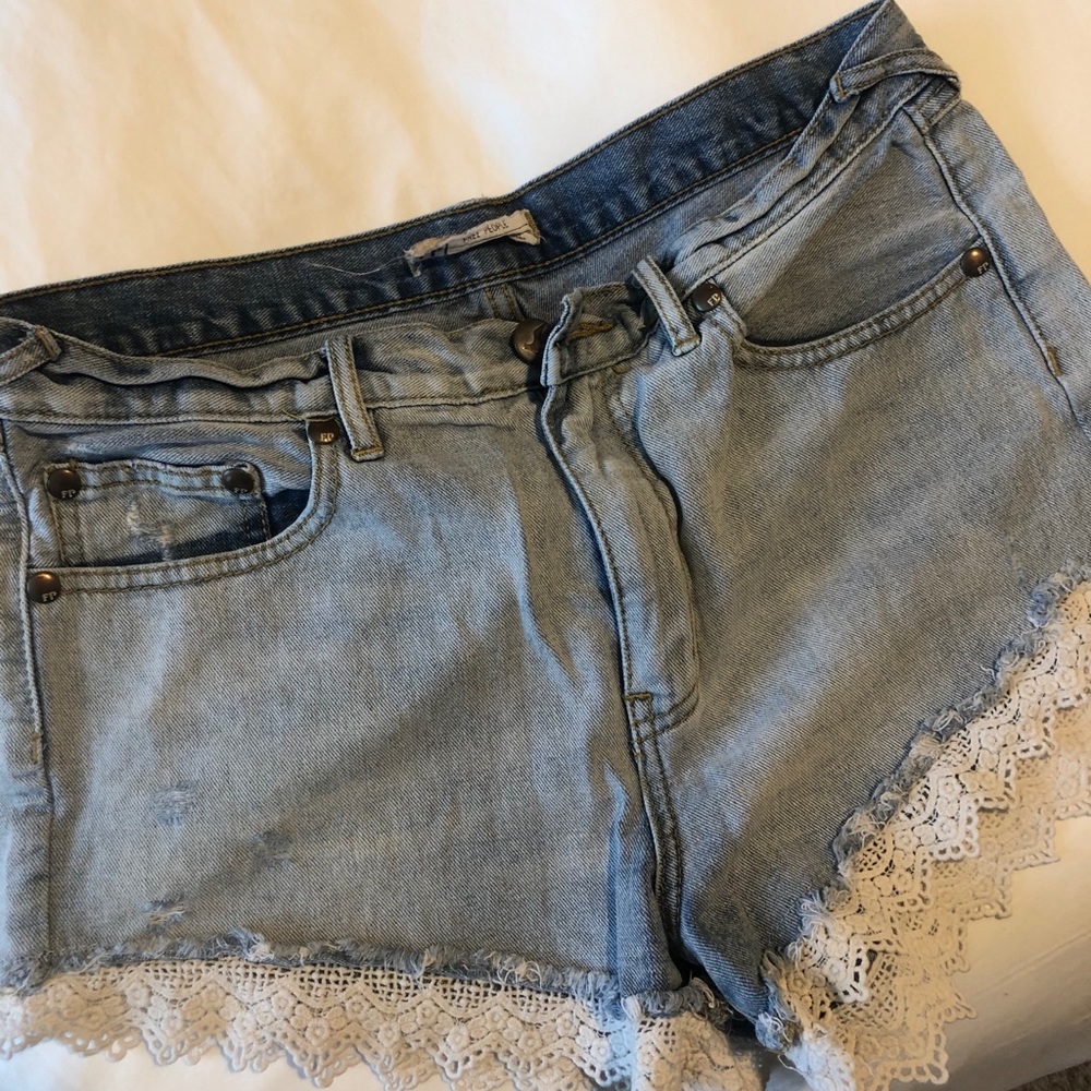 Free people distressed lace trimmed shorts